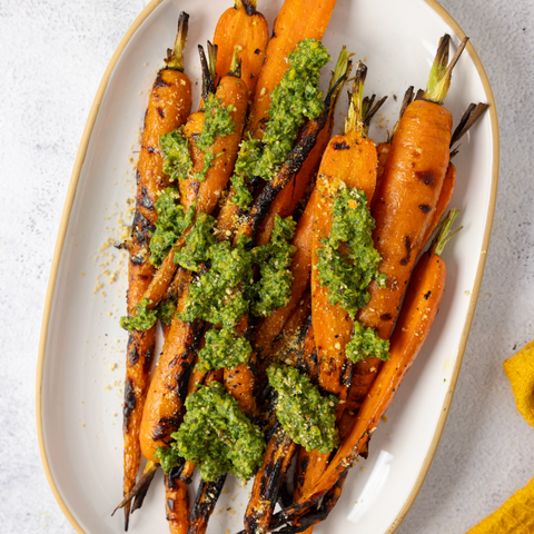 Grilled Carrots Drizzled with a Zero Waste Carrot Top + Basil Pesto